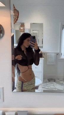 Kylie showing off in the mirror