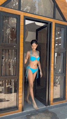 Chinese Walking out of the house in a blue bikini