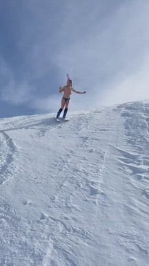 Chelsea Handler skiing bare-breasted